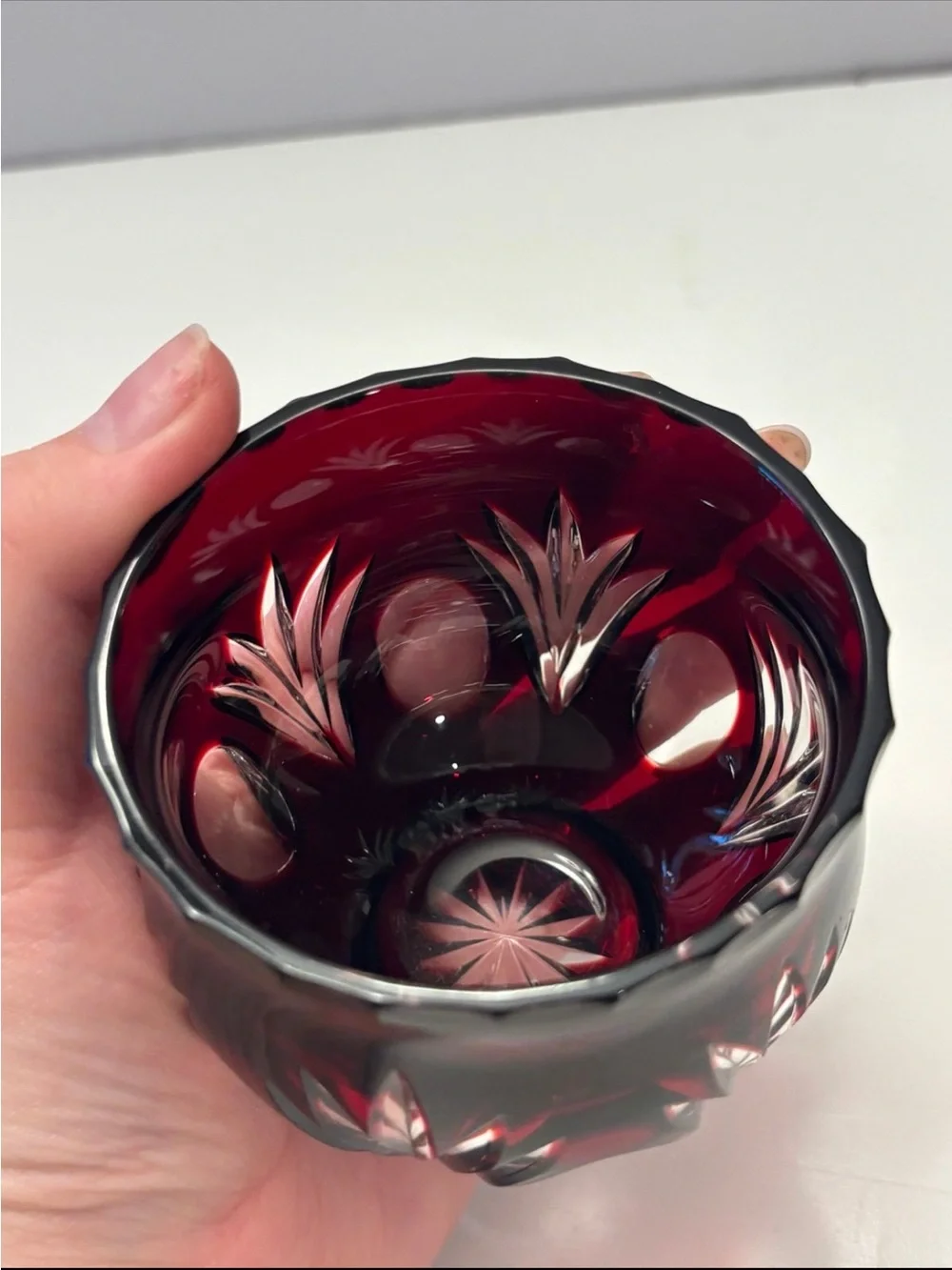 Bohemian Red Crystal glass votive candle holder features intricate cut-to-clear